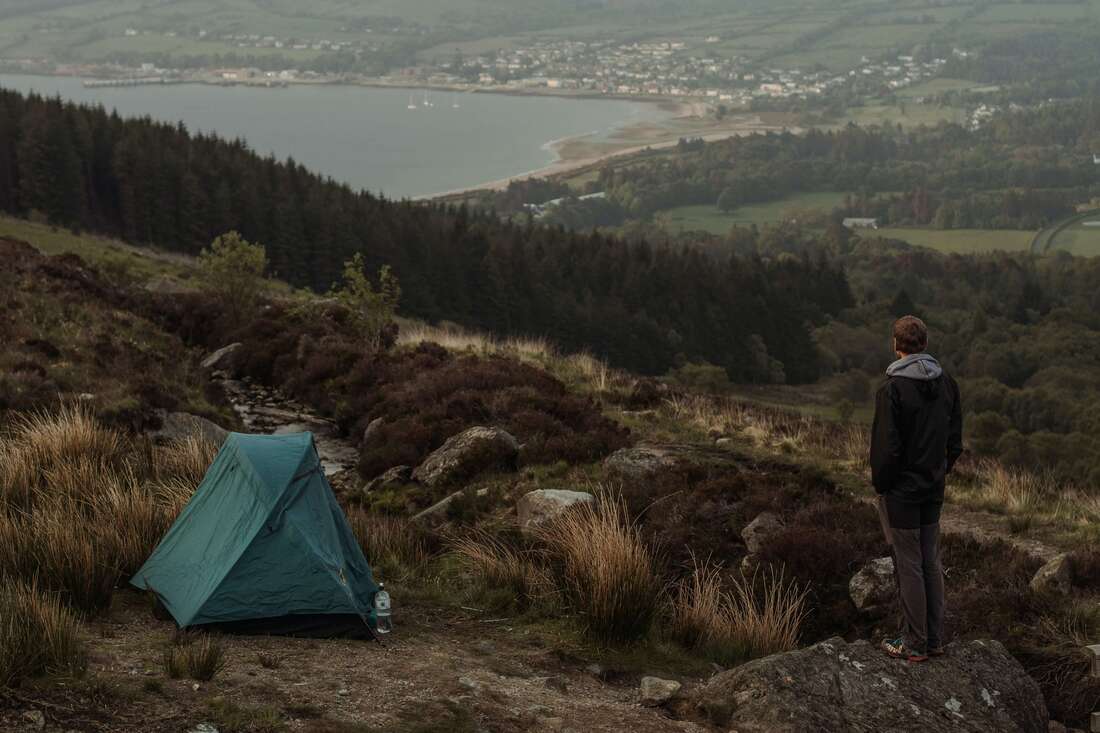 Man enjoying the views over a coastal town in Scotland